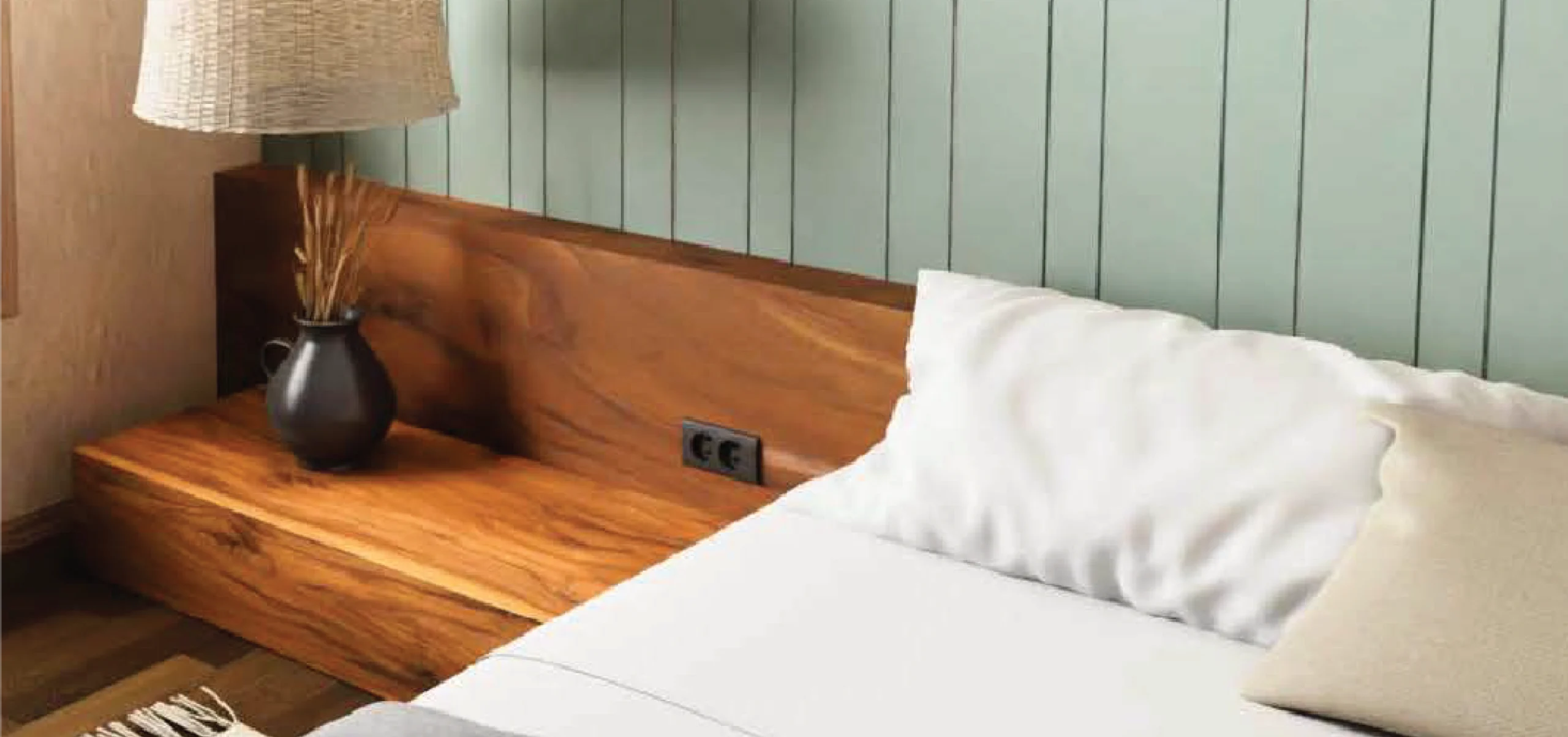 School grey handcrafted wall panels from the Paired Series with subtle vertical line accents, designed to complement a serene bedroom setting.