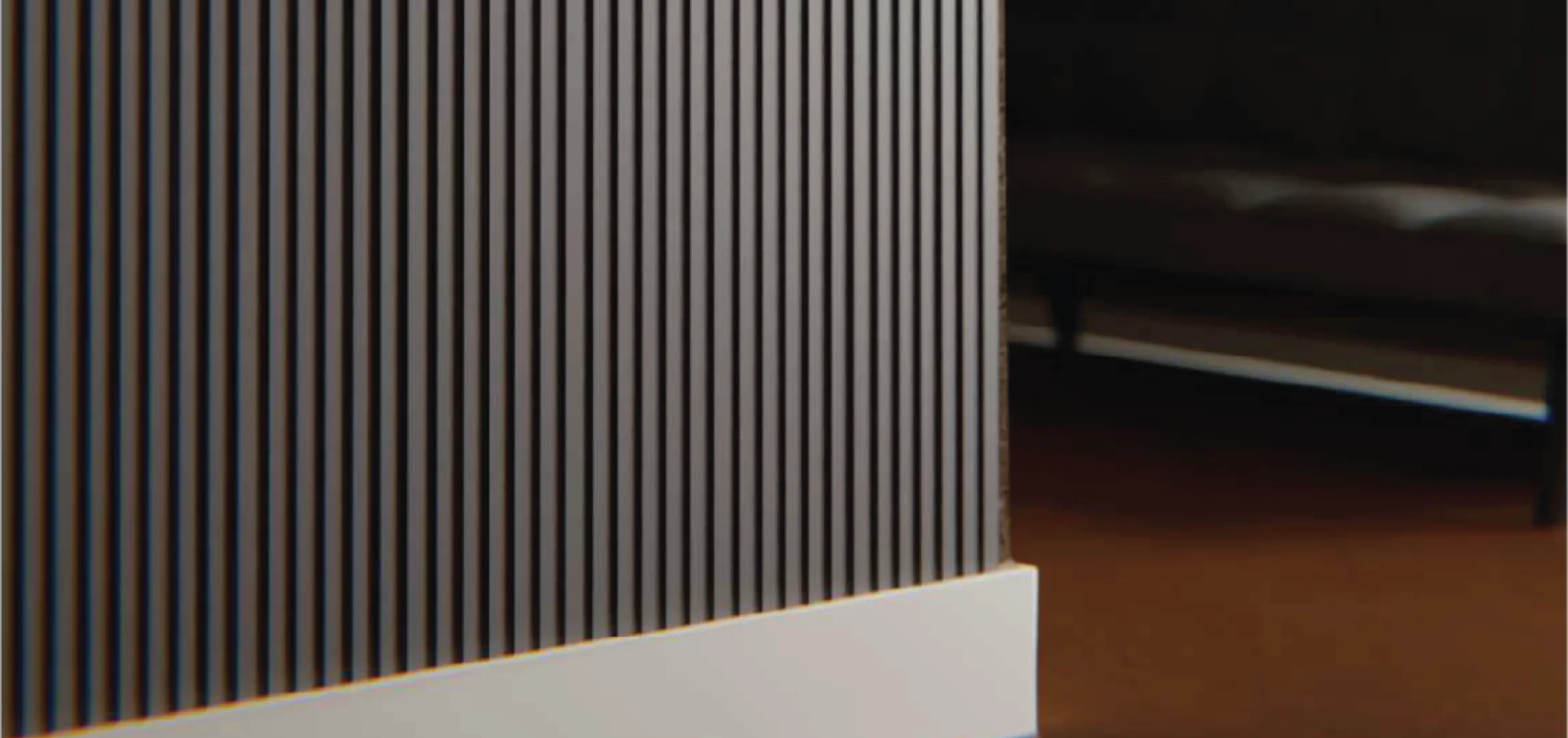 Handcrafted grey louvers featuring a sleek vertical design, ideal for modern and sophisticated interior spaces.