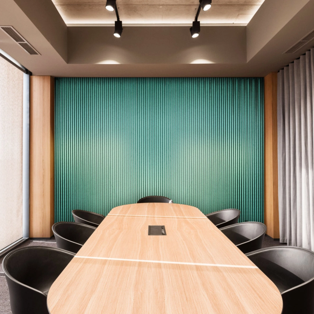 Light green fluted MDF & HDF panel enhancing a modern conference room interior