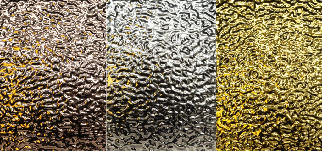 Three reflective art panels with textured surfaces in bronze, silver, and gold tones, showcasing a ripple-like pattern that creates a metallic, light-reflecting effect.