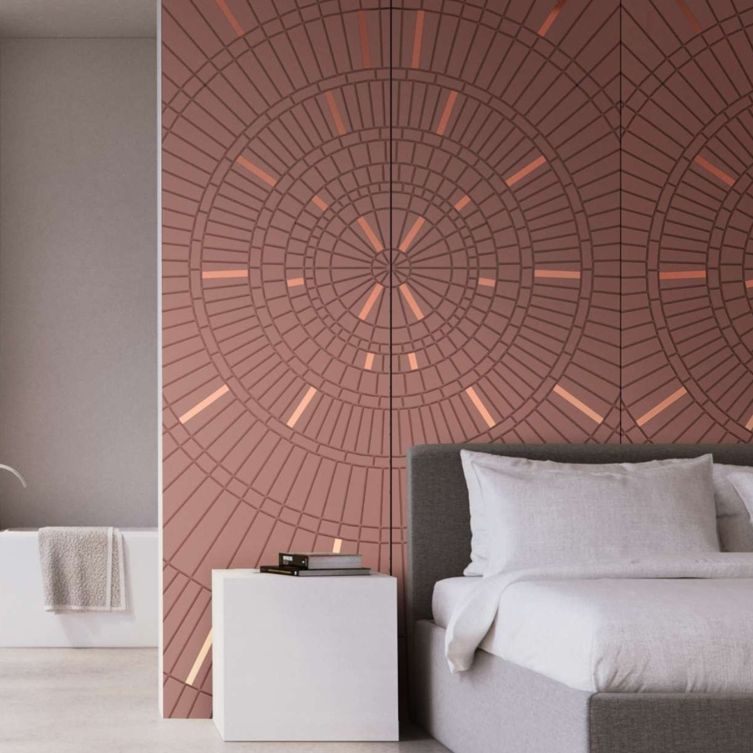 Terracotta handcrafted wall panel with a sunburst pattern and stainless steel inlay in a contemporary bedroom.