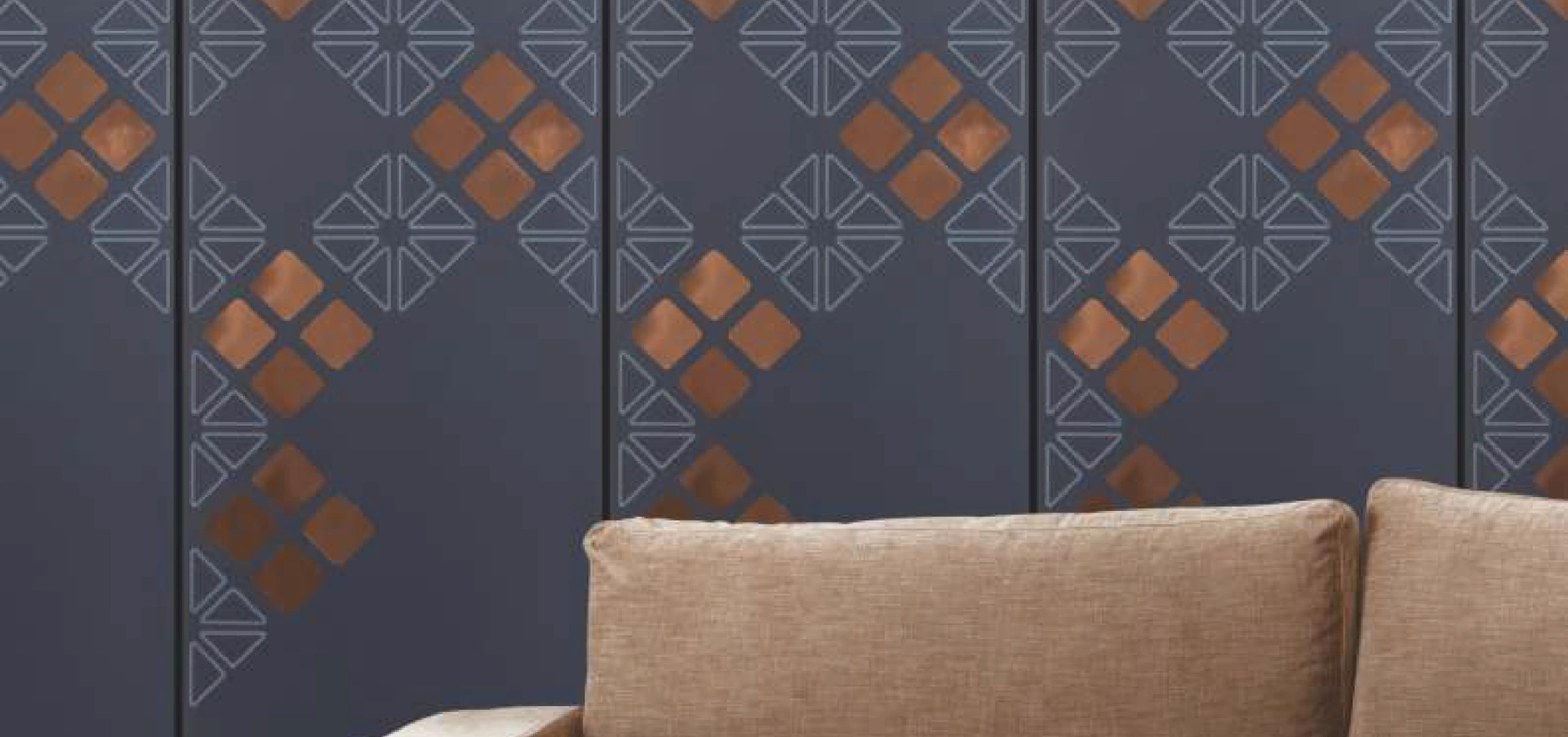 Dark charcoal gray-colored 8x2 charcoal wall panel with geometric copper accents, perfect for creating a modern, stylish interior design.